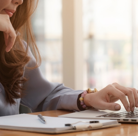 woman searching for things on a laptop