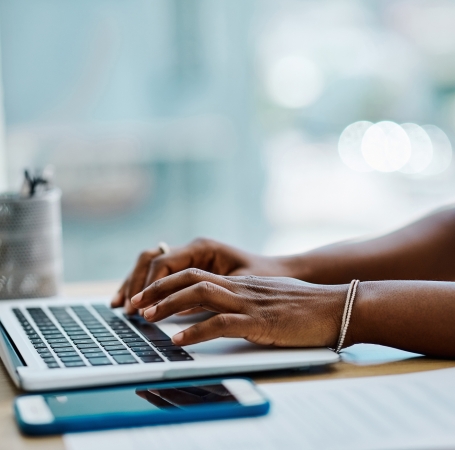 person typing on a computer