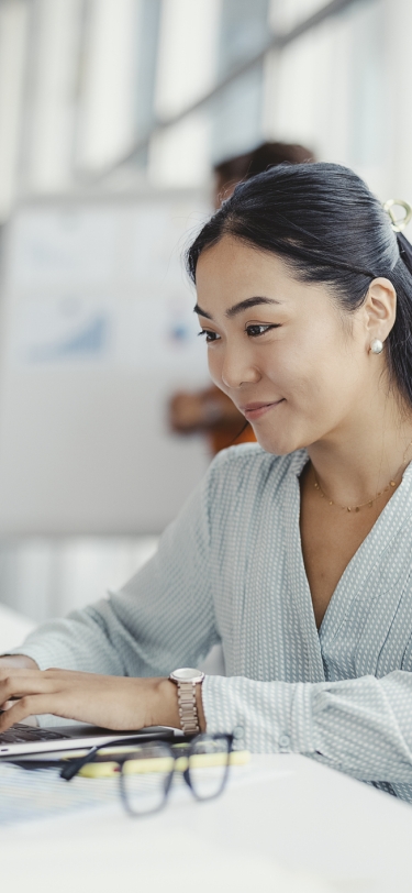 woman sitting in front of a laptop