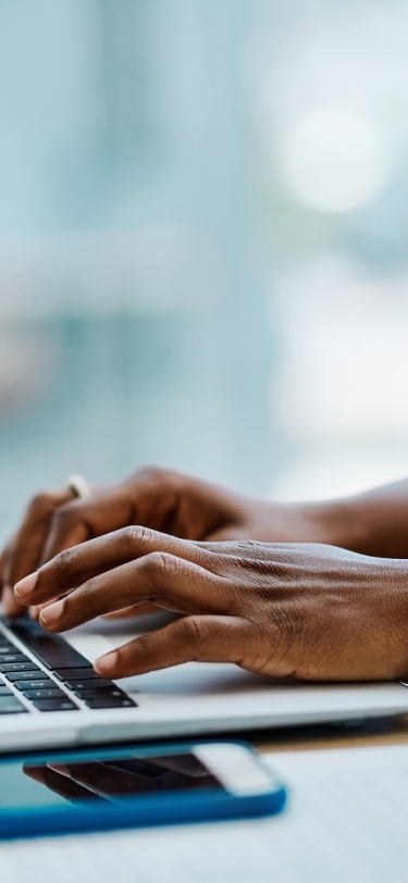 person typing on a computer