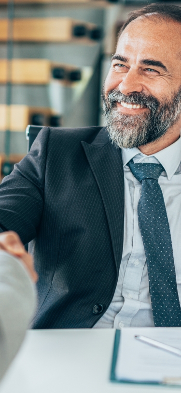 man shaking hands before a job interview